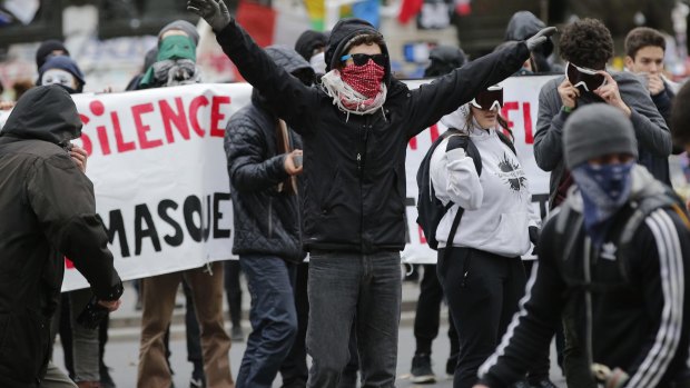 Defiant activists clash with policemen in Paris.