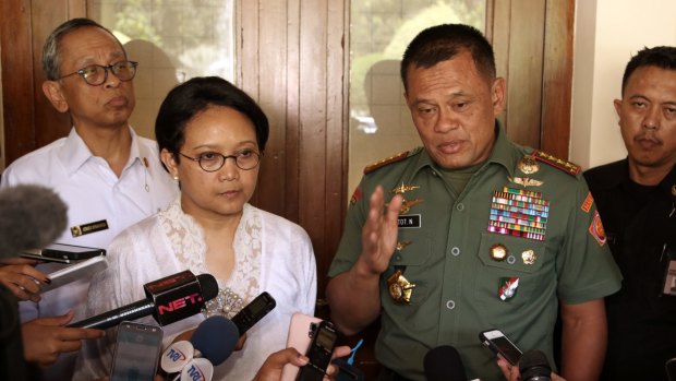 Indonesian Foreign Minister Retno Marsudi, second from left, had demanded that Australian authorities pursue the trespassing case at Indonesia's Melbourne consulate.
