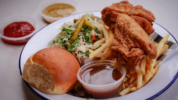 Fried chicken served with  fries, coleslaw, bread and gravy.