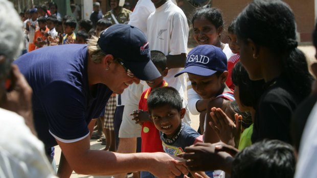 Shane Warne visiting a tsunami refugee camp in southern Sri Lanka in 2005. The Shane Warne Foundation donated money to the aid effort. 
