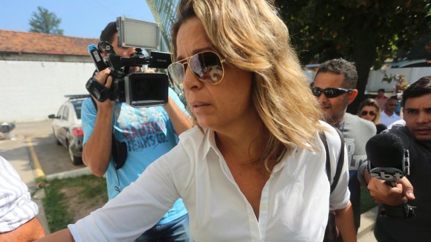 Francoise Amiridis, the wife of Greece's Ambassador to Brazil Kyriakos Amiridis, arrives at a police station to be interrogated in connection with her husband's death.