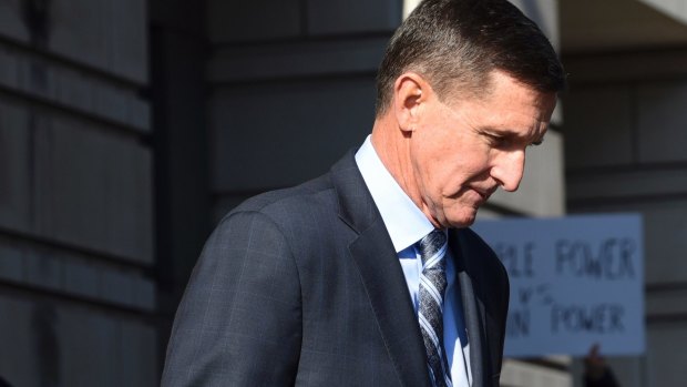 Former Trump national security adviser Michael Flynn leaves court in Washington after pleading guilty to lying to the FBI.