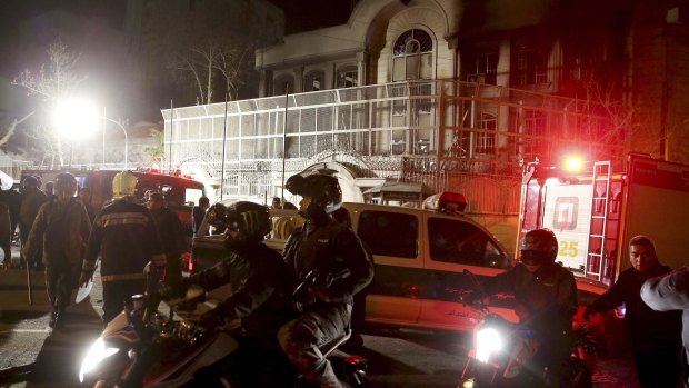 Iranian security forces protect Saudi Arabia's embassy in Tehran, Iran, while a group of demonstrators protest the execution of Shiite cleric  Nimr al-Nimr.