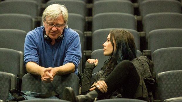 Geoffrey Wright discusses a scene with actor Lily Sullivan (Petra) on the set of the TV series.