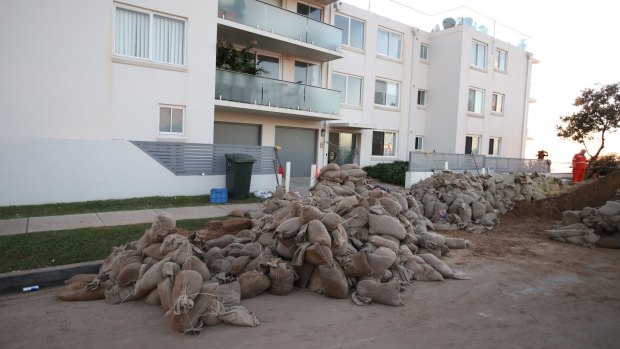 Sand bags surround Collaroy properties on Wednesday morning following another king tide that hit on Tuesday night.