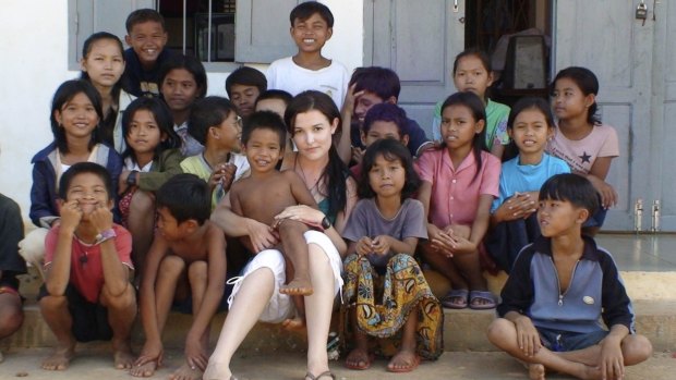 Tara Winkler (seen here with Cambodian children in 2007) set up her own orphanage in  Battambang, in the west of the country, before turning away from centre-based care for children, which she now calls a "trap".