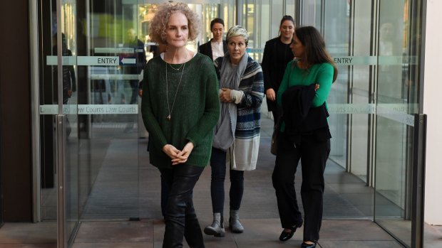 Members of the class action against Johnson & Johnson, Gai Thompson, Joanne Maninon and Carina Anderson, leave the Federal Court on Tuesday.