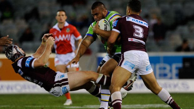 Junior Paulo collides with Manly forward Jamie Buhrer in Friday's 30-18 win. 