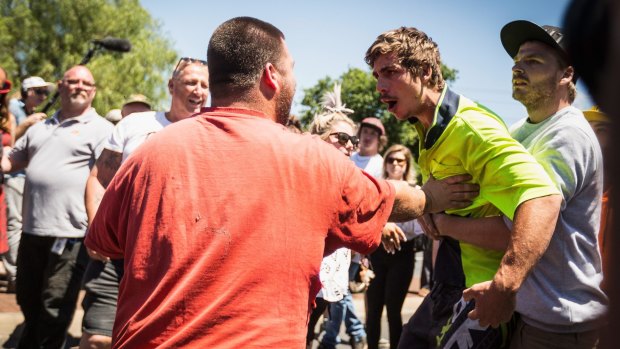 Members of the groups Reclaim Australia and No Room For Racism confront each other.
