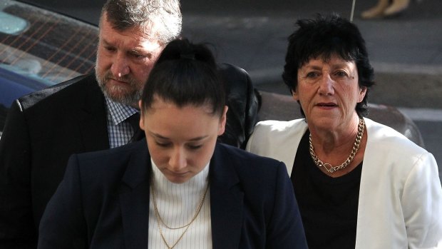 Greg, Virginia and Megan Hughes arrive at the inquest into the death of cricketer Phillip Hughes at the NSW Coroner's Court 