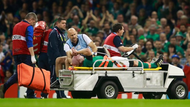 Ireland's captain, Paul O'Connell, is stretchered off against France.