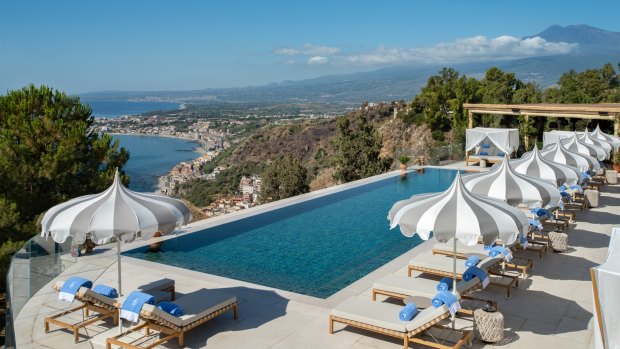 The high-end beachfront retreat features 111 rooms, a Michelin-starred restaurant, manicured Italian gardens and an infinity pool perched above the Ionian Sea.
