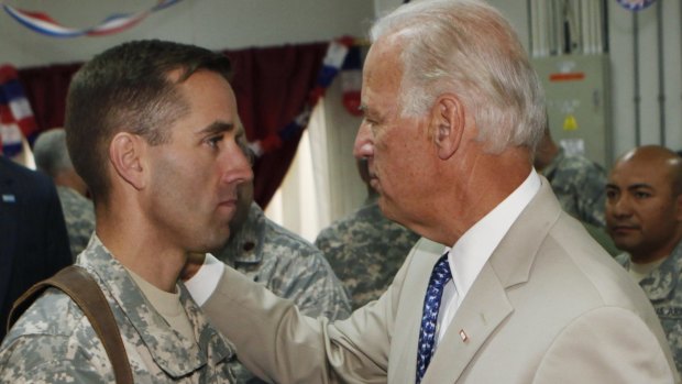 US Vice-President Joe Biden, right, talks with his son, then US Army Captain Beau Biden, at Camp Victory on the outskirts of Baghdad, Iraq, in 2009. 