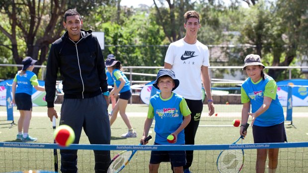 Relaxed: Nick Kyrgios (left) and Thanasi Kokkinakis hold a tennis clinic with Hartwell Primary School students.