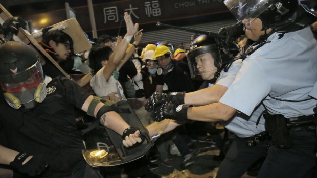 Physical confrontation: Police and protesters clash in Hong Kong.