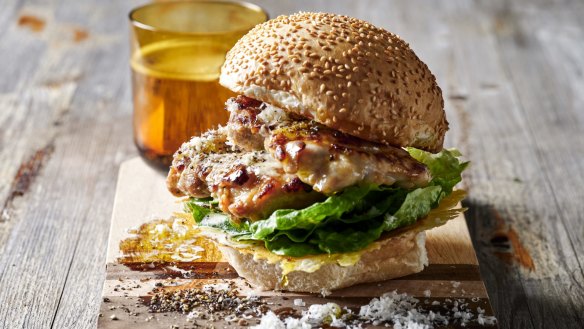 Chicken caesar burger sandwiched by a crispy, lacy, cheesy lid.