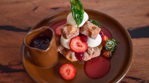 Churros waffles doused in chocolate sauce and mascarpone.