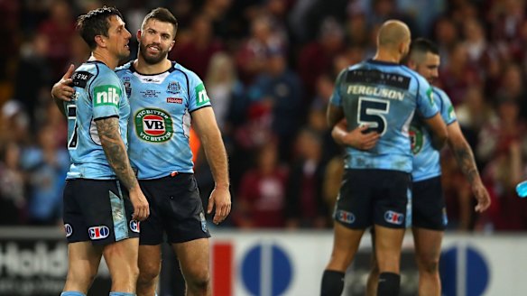 Game over: New South Wales players console each other following game three of State of Origin.