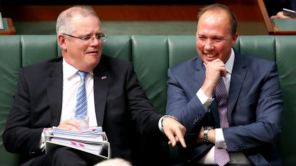 You don't want to know what sort of joke would make Scott Morrison and Peter Dutton laugh this hard. That said: what's Scotty pointing at?