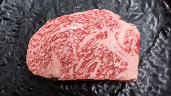 Japanese A5 wagyu beef, heavily marbled with fat.