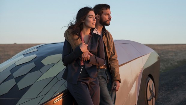 Asha Trace (Melanie Vallejo) and Grey Trace (Logan Marshall-Green) hit a spot of bother with their driverless car in <I>Upgrade</I>.