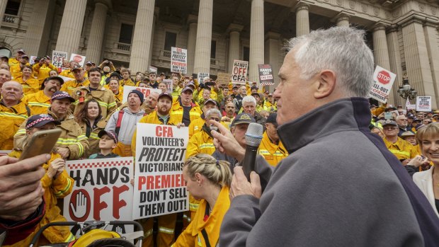 Prime Minister Malcolm Turnbull speaks to CFA volunteer and supporters at a rally earlier this month.