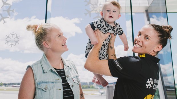 Canberra Capitals captain Nat Hurst with her wife Tara and their son Nash (6 months).