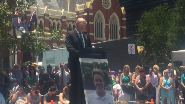 Wally Lewis speaks at the public memorial for Mr Miller, a week after the young man died.