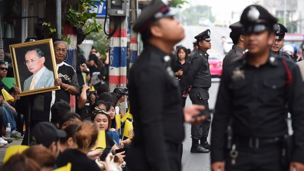 Police officers dressed in black as they patrolled the streets on Bangkok on Friday.