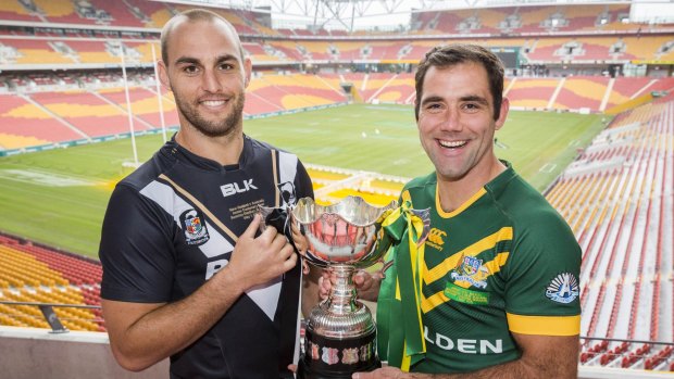 Prize possession: (From left) New Zealand captain Simon Mannering and Australian captain Cameron Smith pose with trophy ahead of Friday night's Test at Suncorp Stadium.