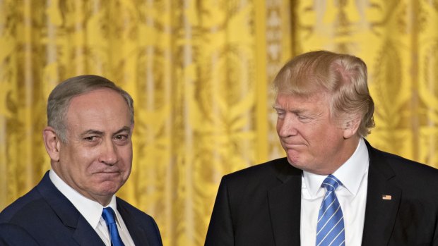 US President Donald Trump, right, looks towards Benjamin Netanyahu, Israel's prime minister, during a news conference in the East Room of the White House in Washington, DC.