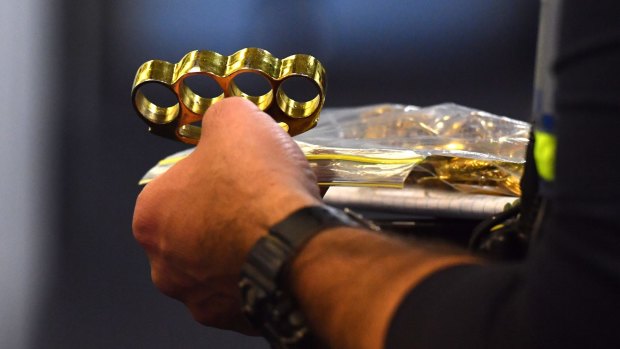 Items seized by police included gold knuckle-dusters.