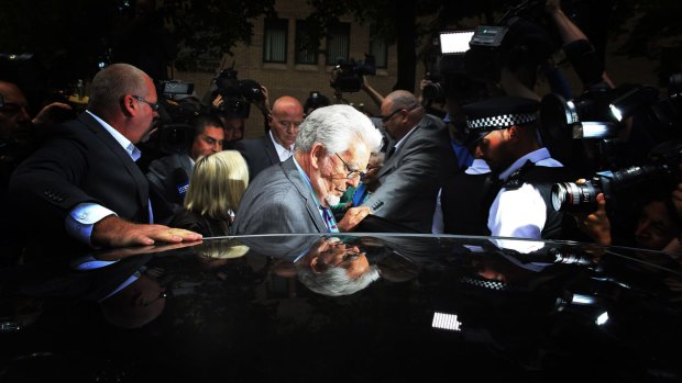 Rolf Harris leaves Southwark Crown Court in London during his 2014 trial.