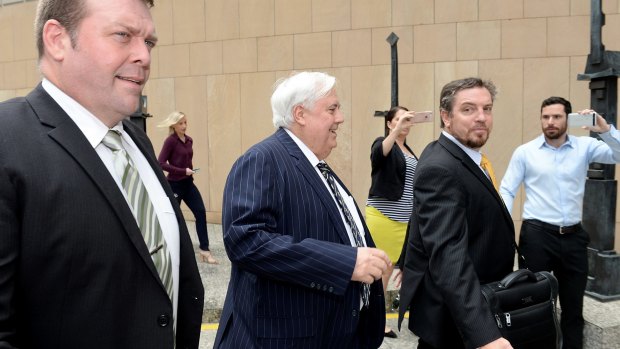 Mr Palmer was flanked by security for his third Federal Court appearance.