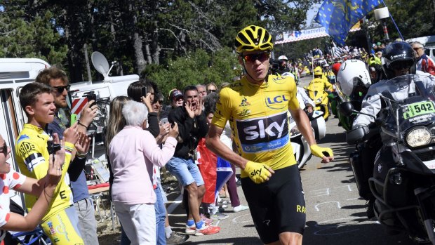 Britain's Chris Froome runs after he crashed at the end of the 12th stage of the Tour de France.
