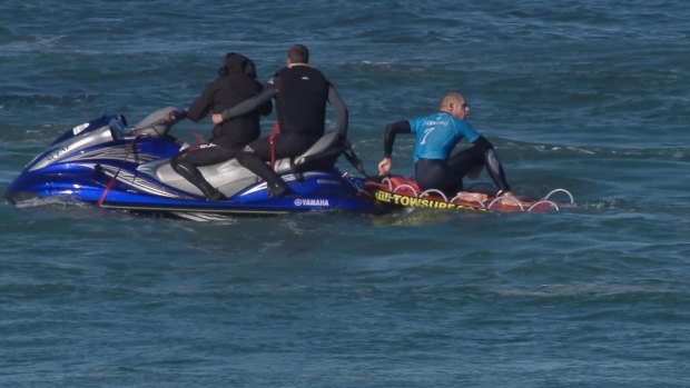 The other Mick Fanning with rescuers after the shark attack.