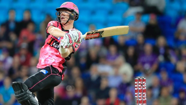 Over the top: Sam Billings goes high and long for the Sixers in their frantic run chase.