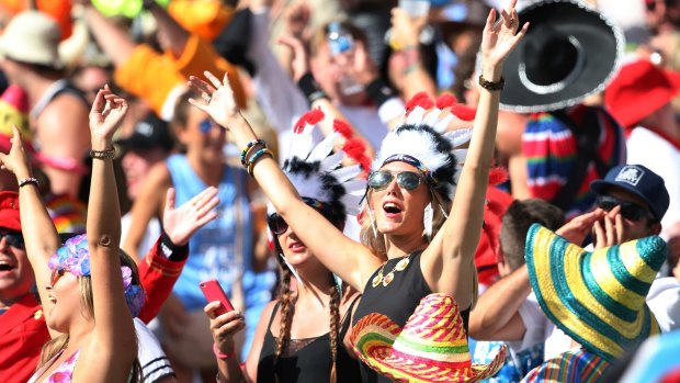 Party crowd: Sevens fans sing in the sunshine at Allianz Stadium.