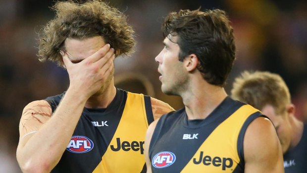 Questions are mounting around key forward Ty Vickery,left, with Alex Rance.