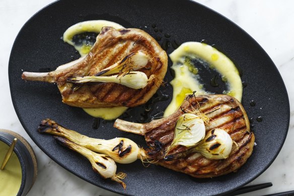 Barbecued pork chops with lemon garlic sauce and pickled spring onions.