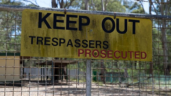 Barbed wired and clear signs border this property in the Riverstone subdivision where some landowners have chosen to live surrounded by bushland despite limited access to amenities.