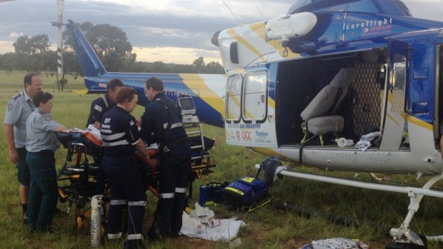 The Surat Gas Aero-Medical helicopter team takes a man to Toowoomba Hospital after a suspected quad bike rollover