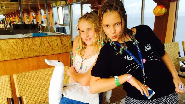 Rachel Browne's children, Phoebe and Izzy Myers, ham it up shortly before the storm hit on Monday. 