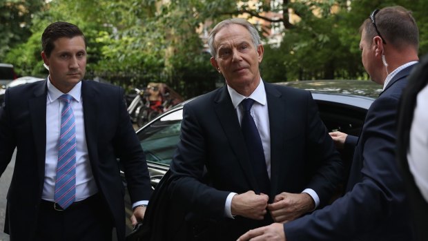 Tony Blair arrives back at his home after a press conference following the outcome of the Iraq Inquiry report.