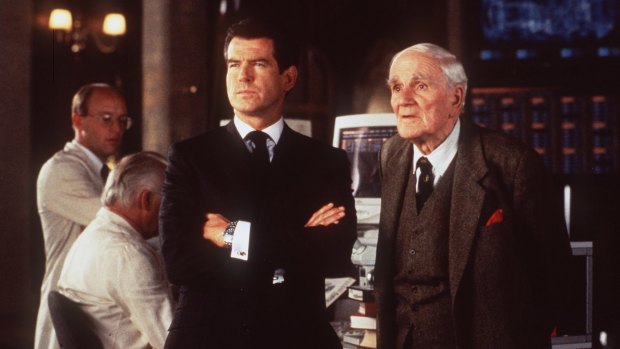 Pierce Brosnan as James Bond and Desmond Llewelyn as the ingenious Q in the 1999 film
<i>The World is Not Enough</i>.