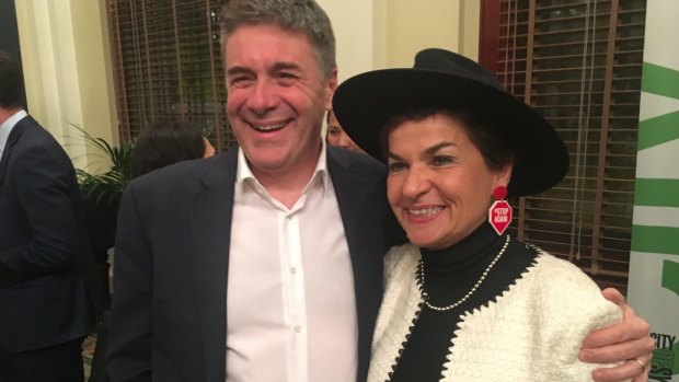 Christiana Figueres wearing Stop Adani ear rings, with Andrew Petersen, CEO of Sustainable Business Australia. 