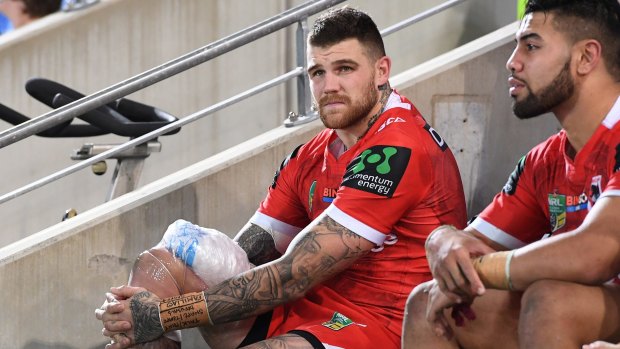 Hobbled: Josh Dugan looks on after sustaining an injury against the Titans.