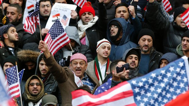 American Muslims gather on the steps of Brooklyn's Borough Hall, during a protest against Trump's temporary travel ban.