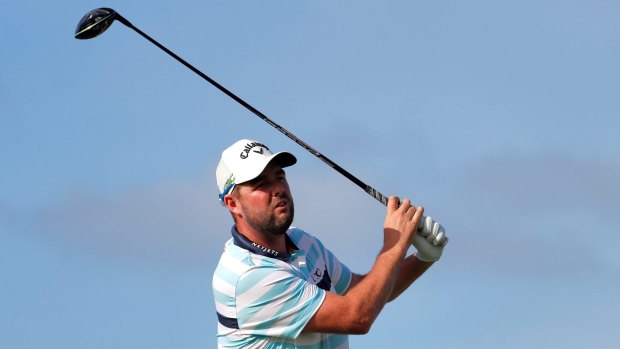 Equal leader: Marc Leishman tees off on the 14th.