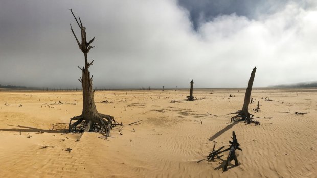 Theewaterskloof Dam, a key source of water supply to Cape Town, South Africa, is shown at low levels in April 2017. The city announced new water restrictions Thursday, Jan 18, 2018 to combat the drought, saying it was looking more likely that it will have to turn off most taps on "Day Zero," or April 21, 2018. Mayor Patricia de Lille said 60 percent of residents are "callously" using more than the current limit and that the city will fine households that use too much water.